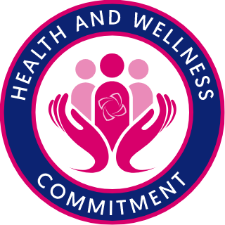 A dark blue and pick round badge, with message - health and wellness commitment